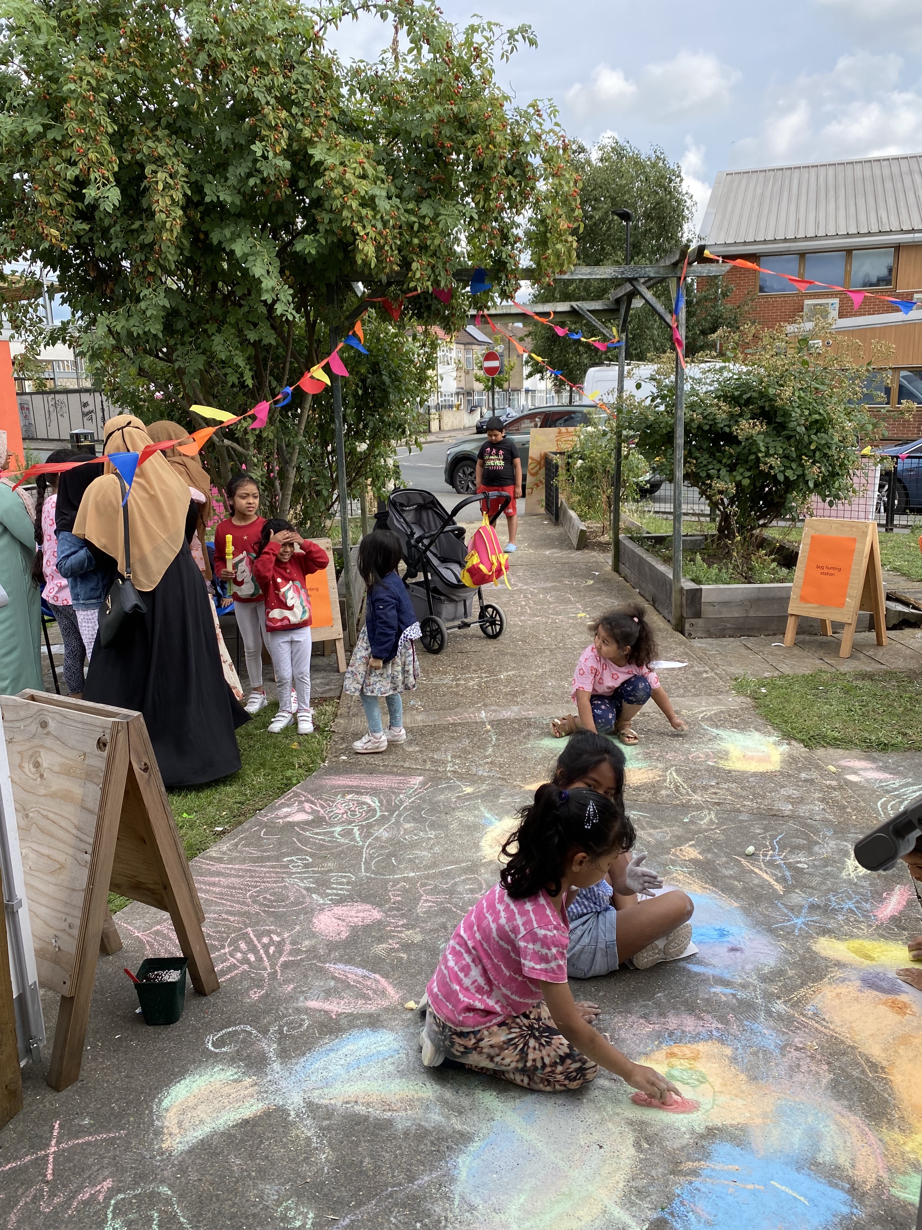 Drawing the bugs with chalk outside