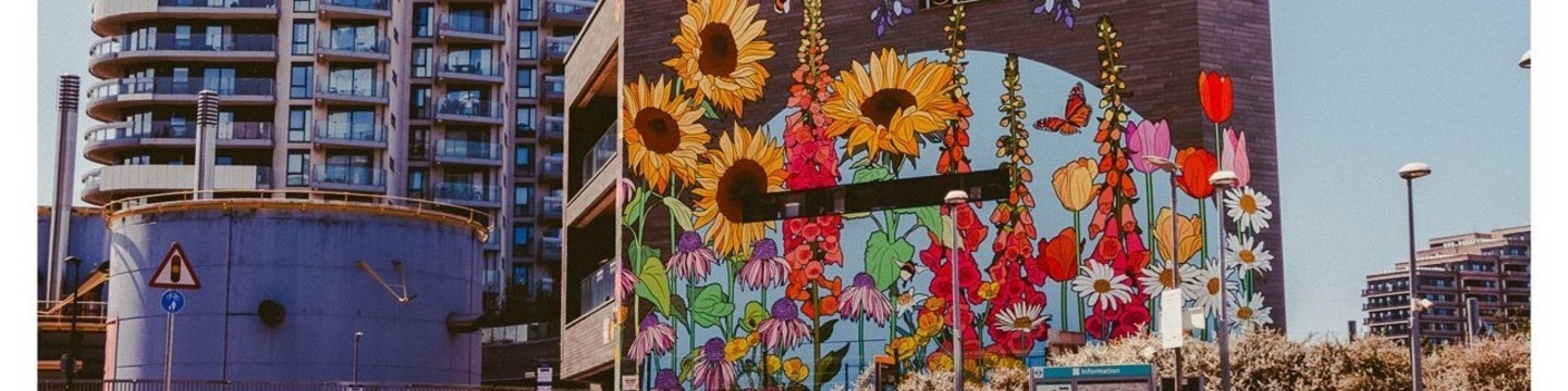 A cropped image of a vibrant floral mural on a building