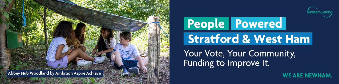 The image shows a group of children sitting under a makeshift shelter in a wooded area, engaged in conversation. The shelter is made from a tarp tied between trees. On the right side of the image, there is text that reads "People Powered Stratford & West Ham. Your Vote, Your Community, £200,000 to Improve It." There is also a logo for Newham London and the phrase "WE ARE NEWHAM." At the bottom left corner of the image, there is text that reads "Abbey Hub Woodland by Ambition Aspire Achieve."
