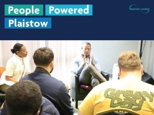 The image shows a group of people seated in a room, with some facing away from the camera and others facing towards it. The text "People Powered Plaistow" is prominently displayed at the top of the image. There is also a logo for "Newham London" in the upper right corner.
