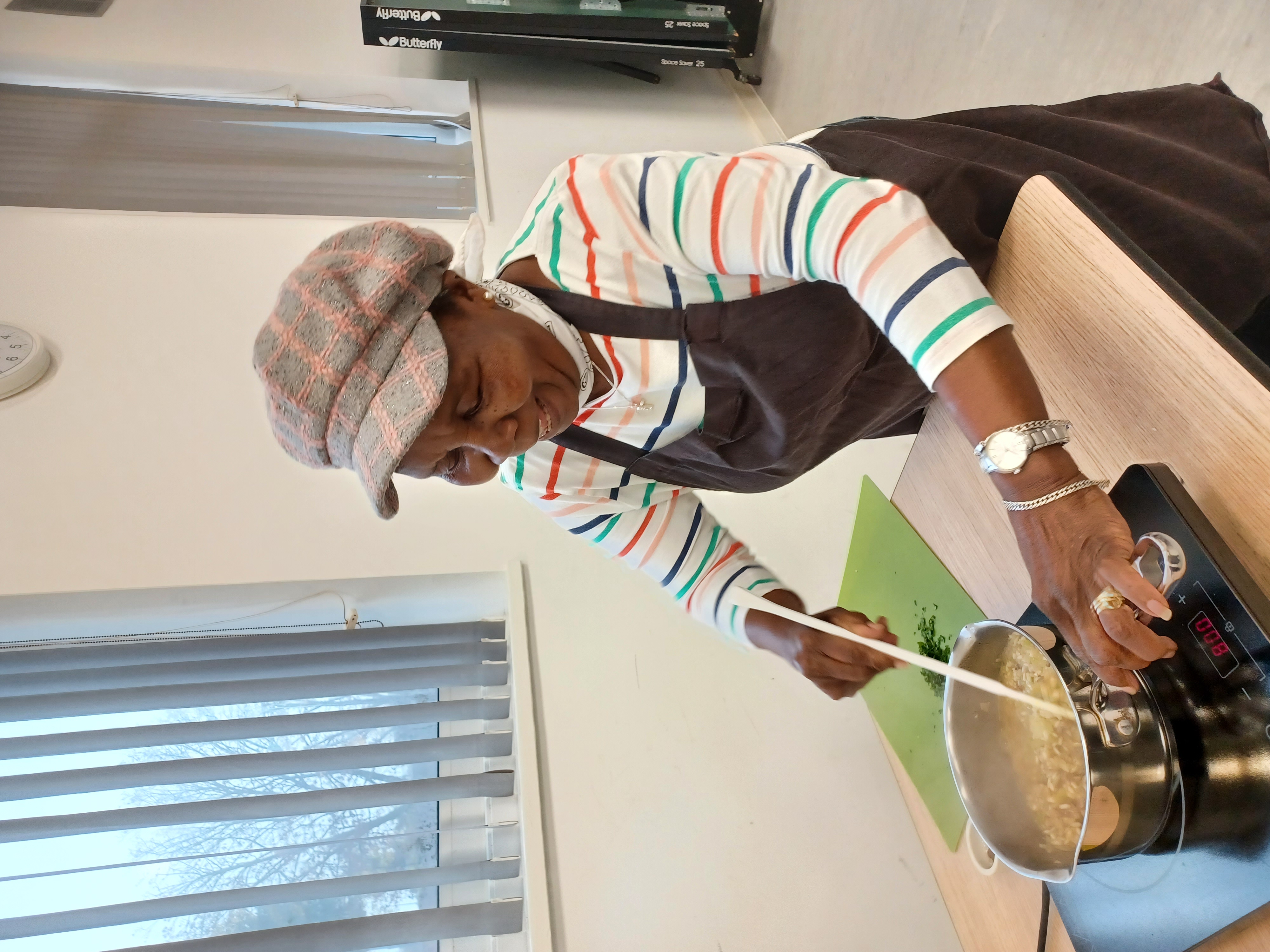 Lady stirring risotto