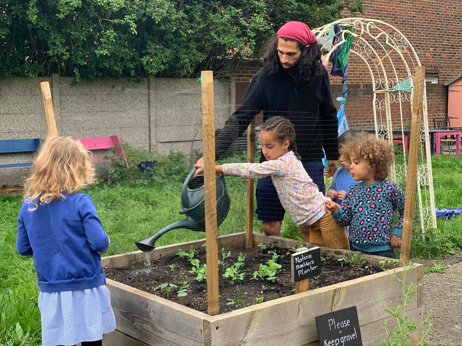 we sowed edible flower, carrot and pea seeds, and the children look after them every week