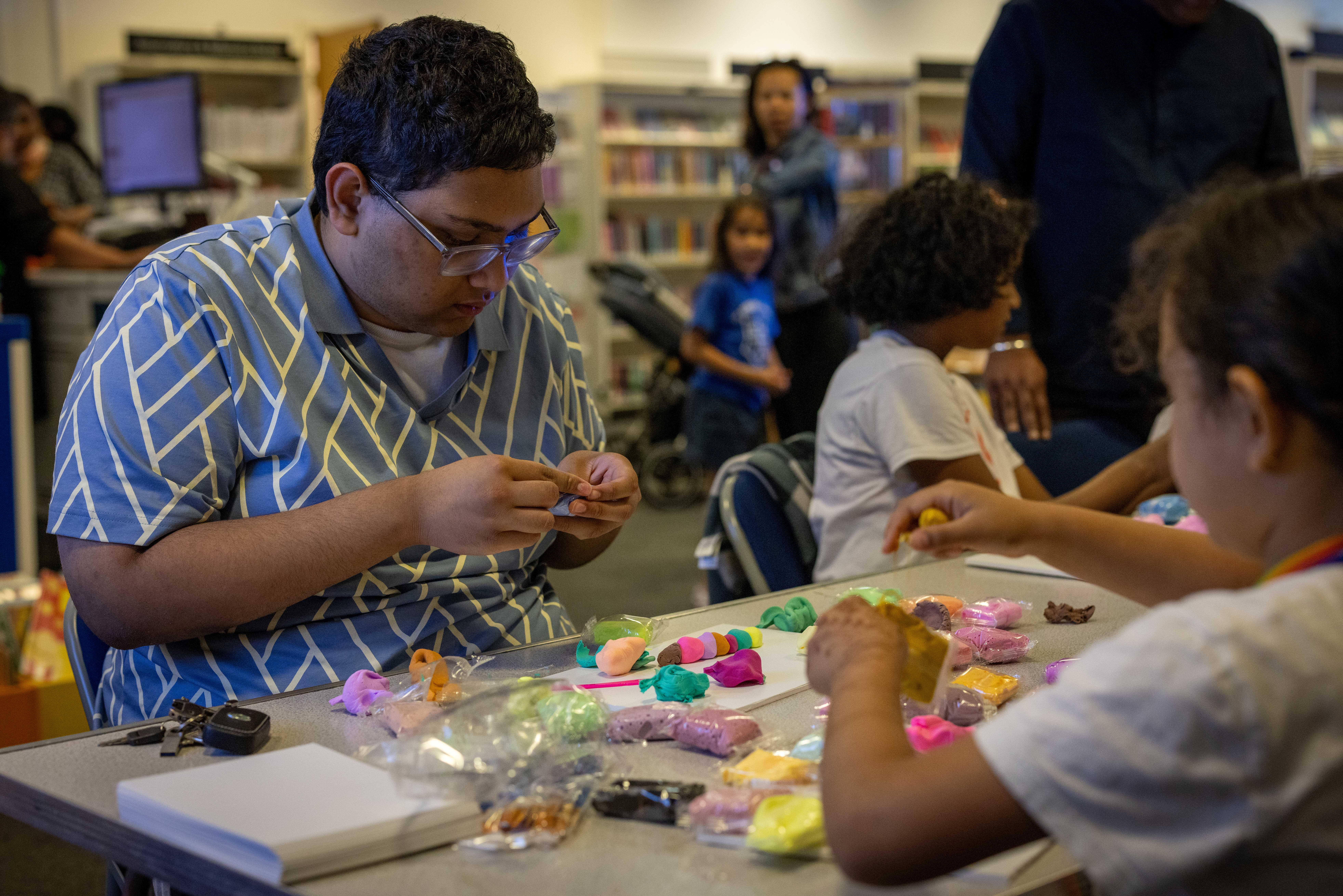 Young person making clay model