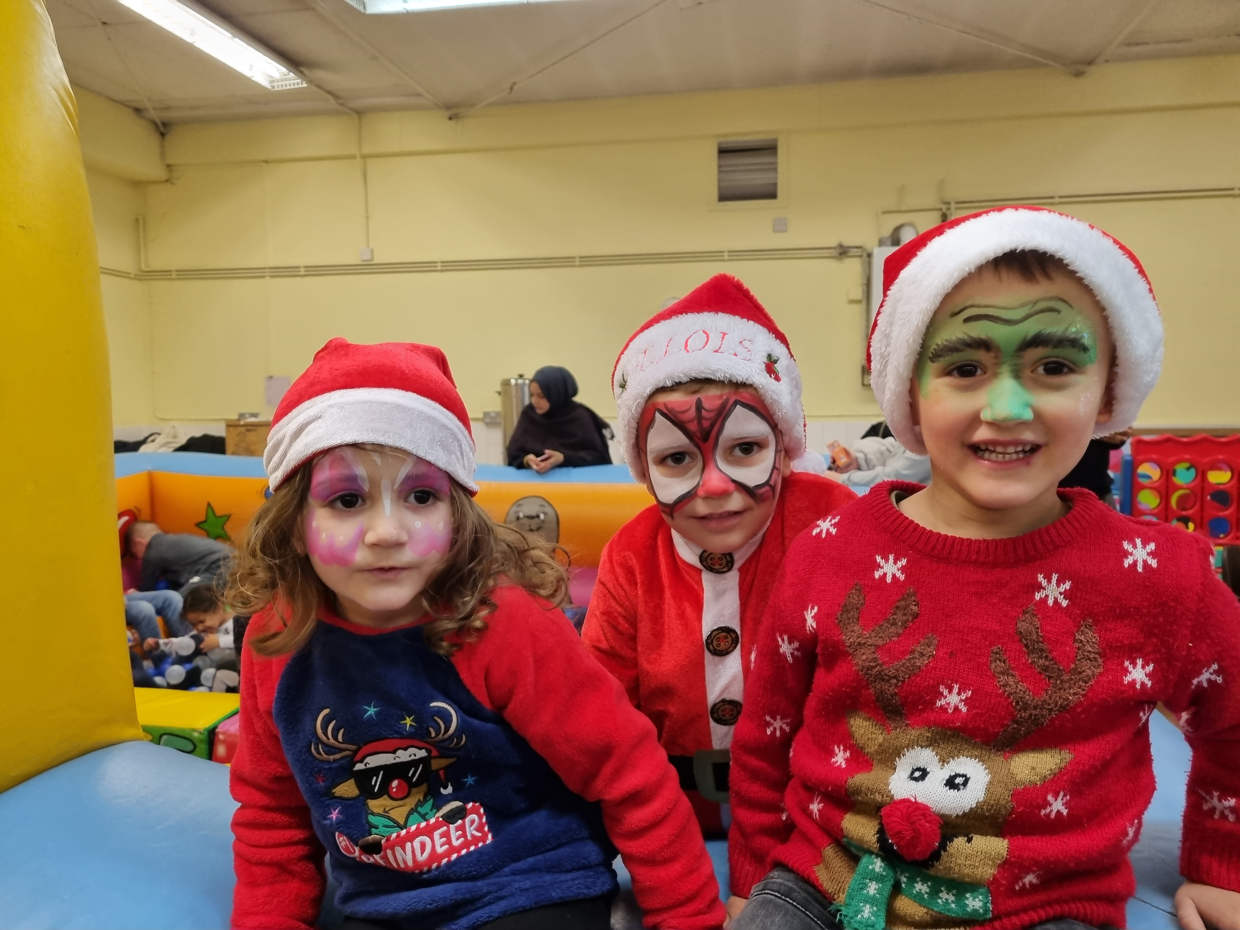 Children in the festive mood having fun in the soft play area.