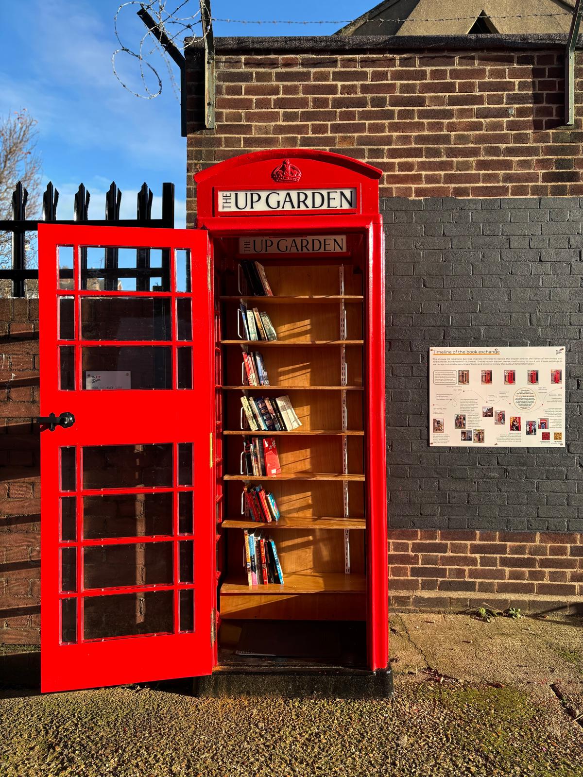 renovated phone box, now containing books on shelves