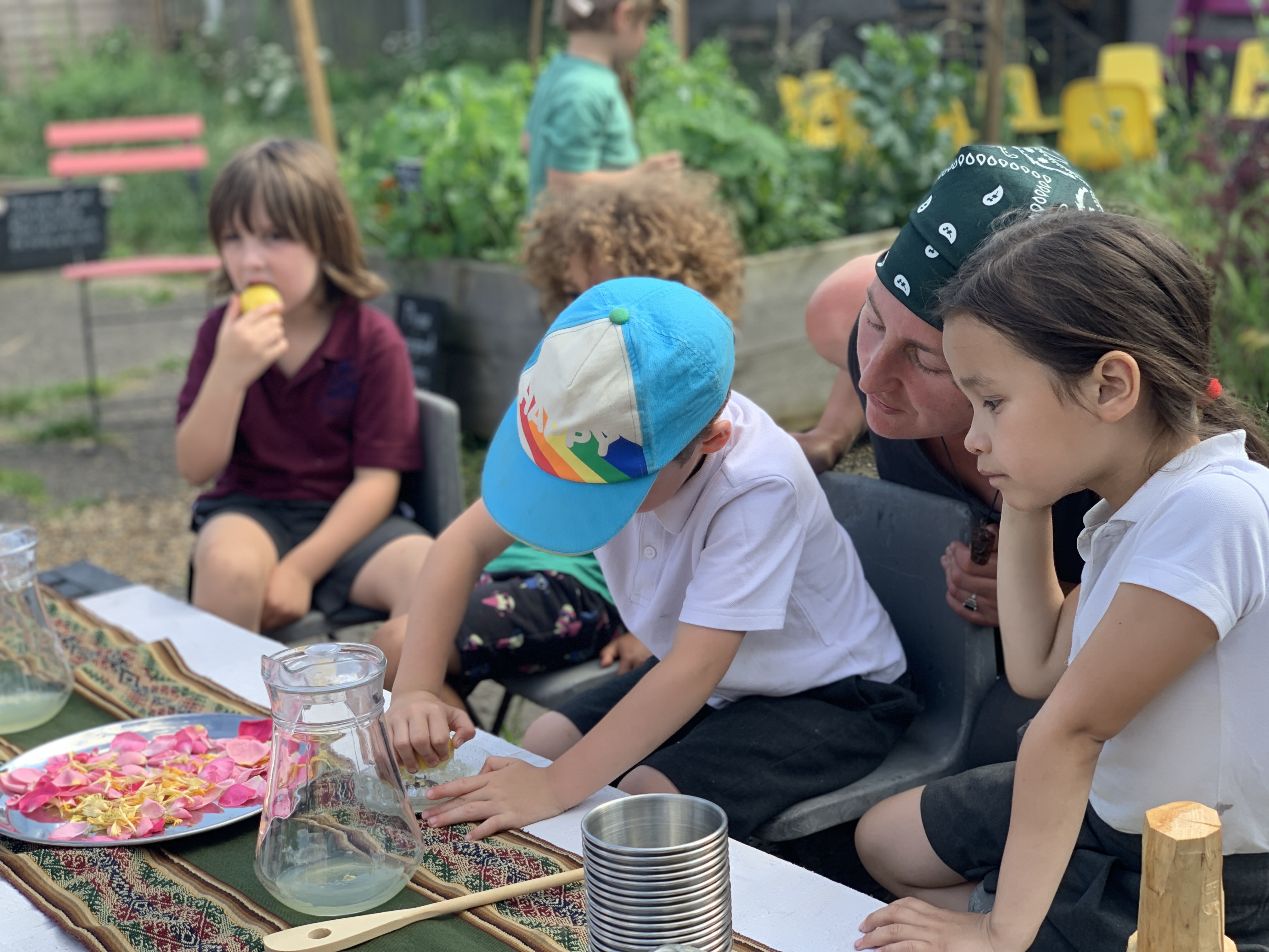 the children making rose honeysuckle lemonade