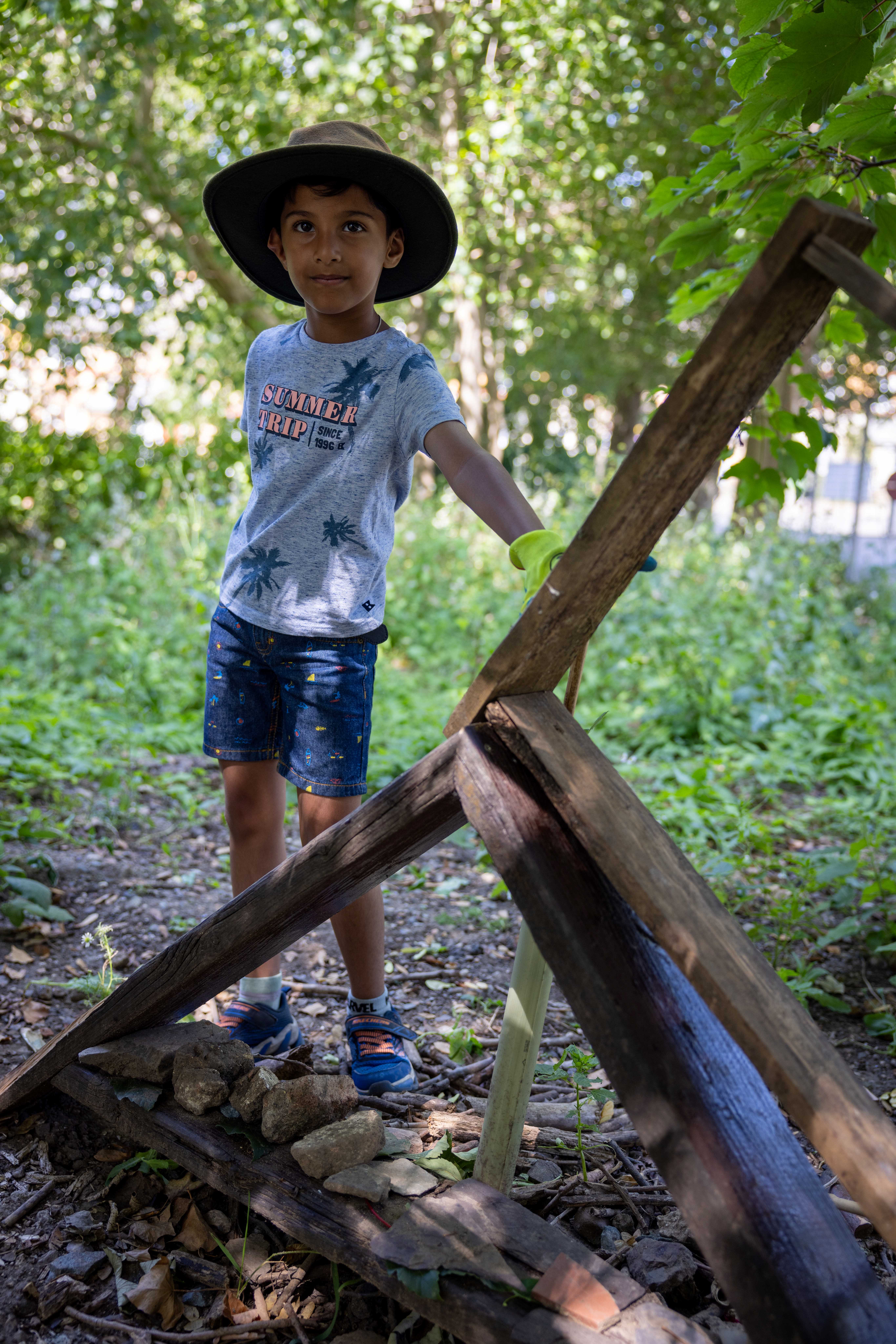 Child making a bug hotel