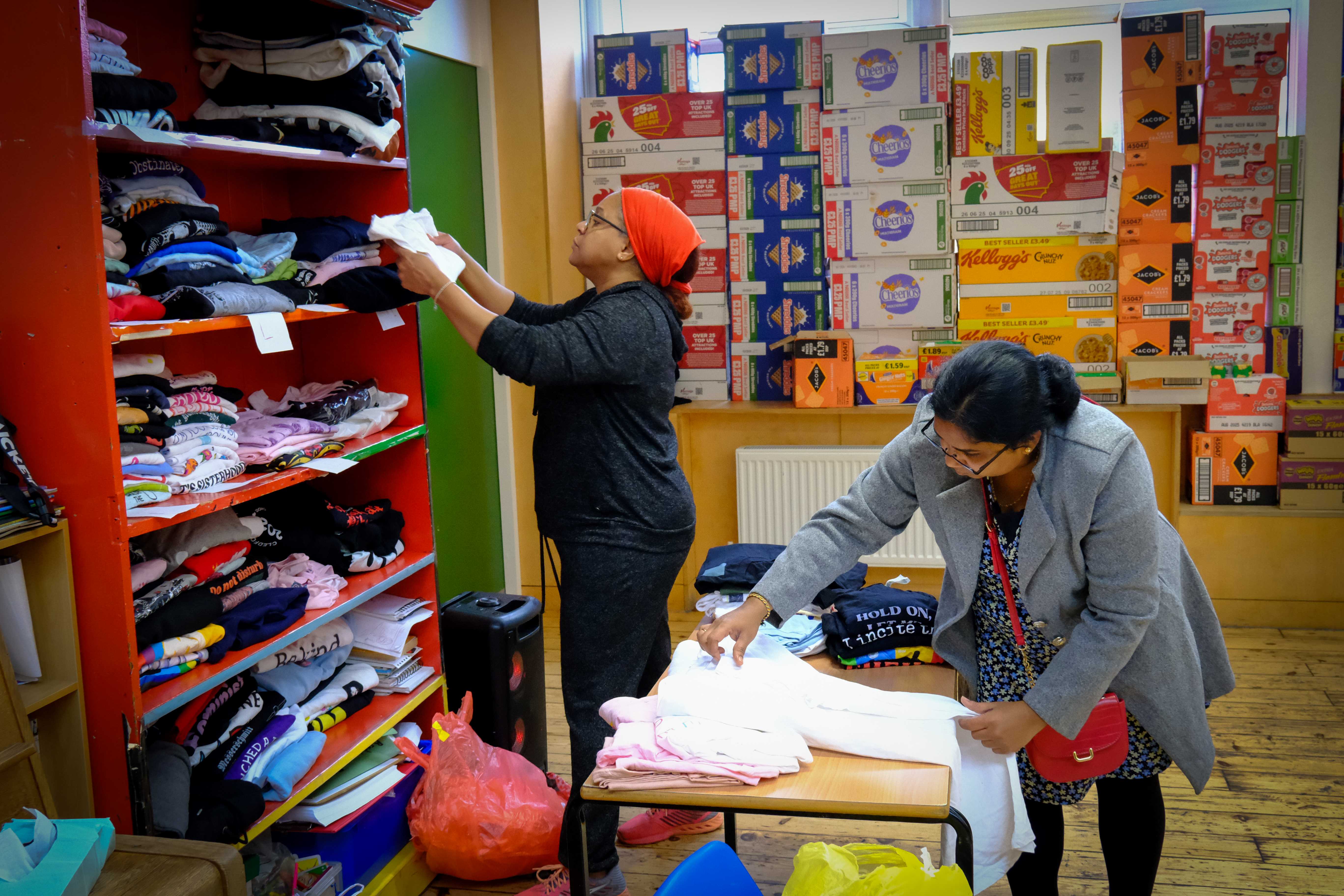Volunteers sorting clothes donations