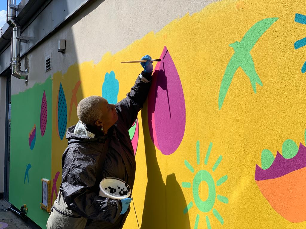 Nursery wall mural – a Forest Gate Women’s Institute volunteer painting the detail: