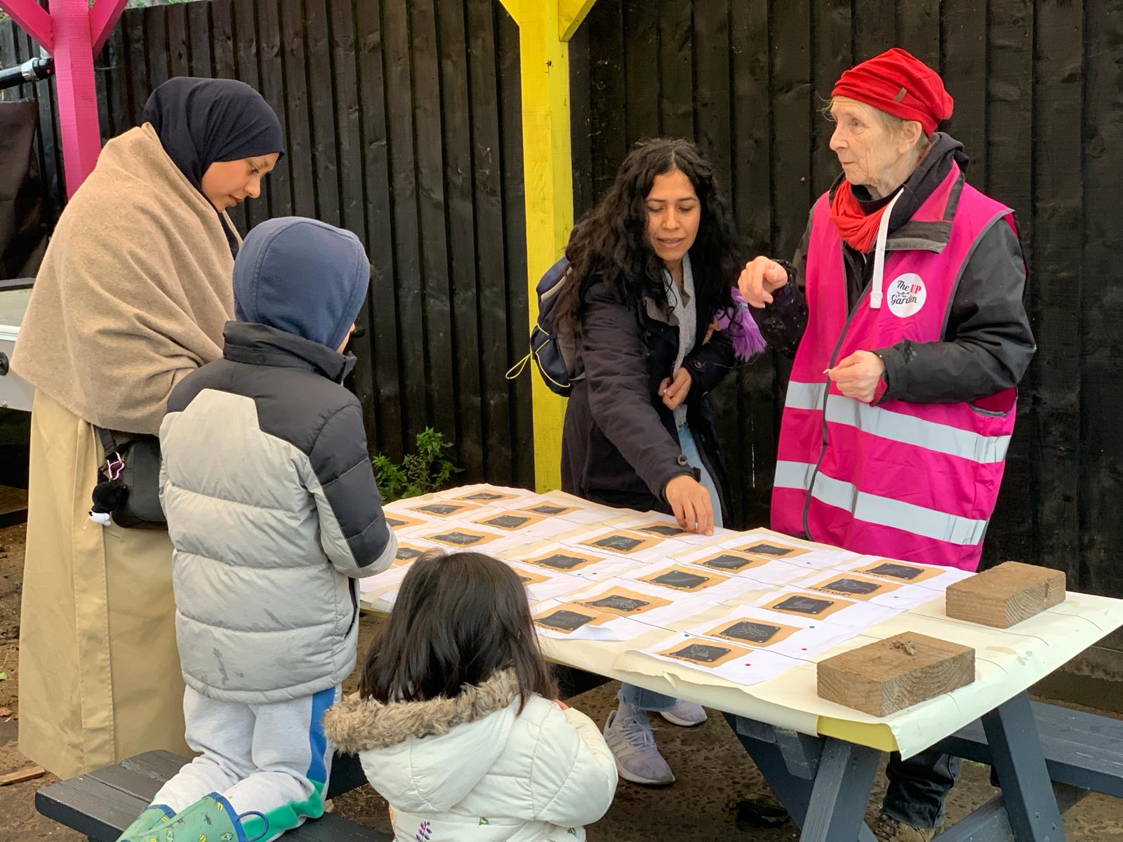 nature trail project lead with members of the public, voting on designs